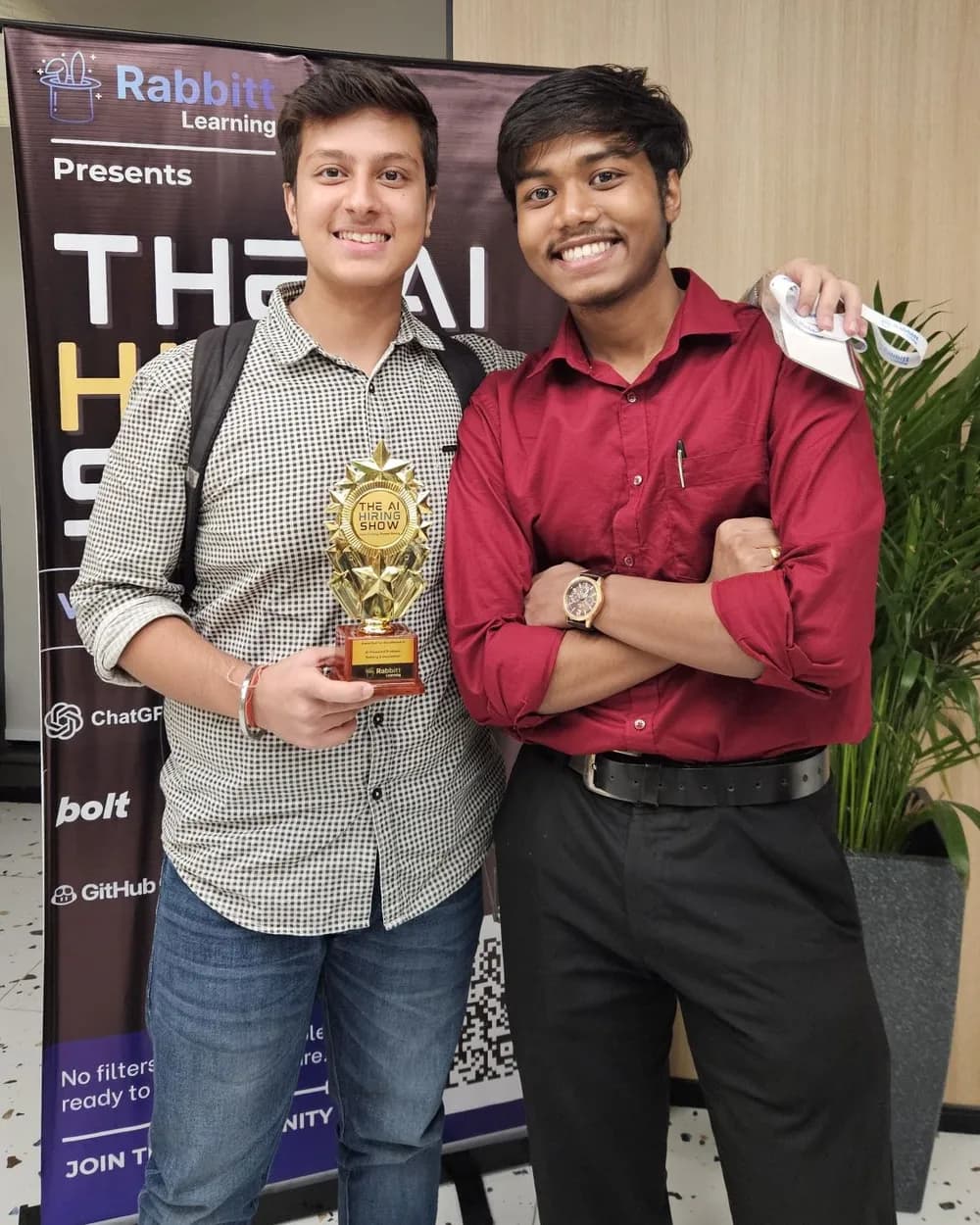 With a teammate and trophy at The AI Hiring Show by Rabbitt