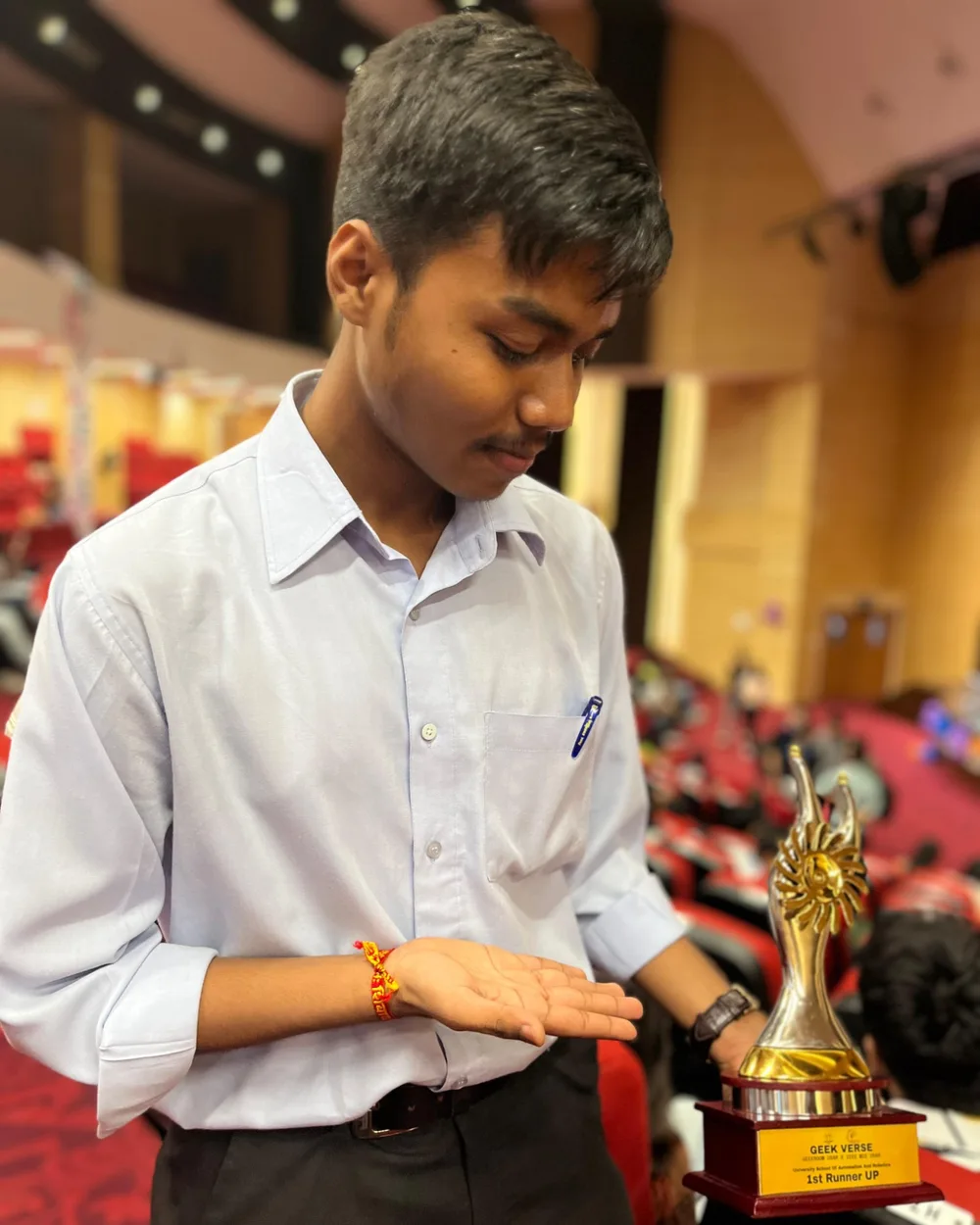 Holding the Geekverse 1st Runner Up trophy